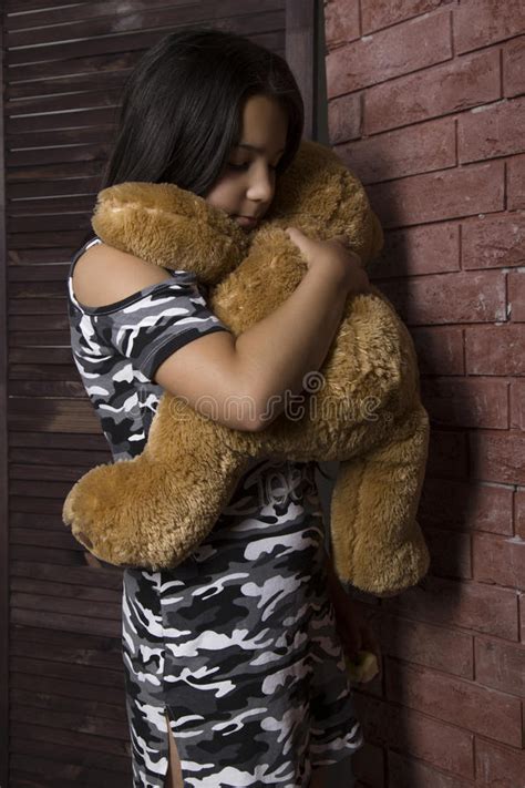 Sad Little Girl Embracing Her Teddy Bear Punished Girl Standing Near