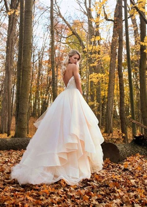 Long, sheer sleeves down to the wrist are super elegant, and work well if you're planning a traditional celebration in church or a winter wedding when you might wedding dresses with sleeves. Gorgeous strapless tulle ball gown | 100 Wedding Dresses
