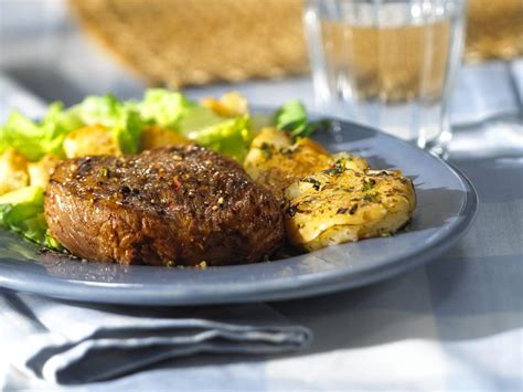 The mashed potatoes are infused with the smoke from the plank and juices from the beef. Beef Tenderloin Medallions with Potato Gratin and Salad Recipe | EatSmarter