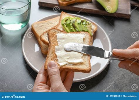 Woman Spreading Butter On Toasted Bread Stock Photo Image Of Gastronomy Piece