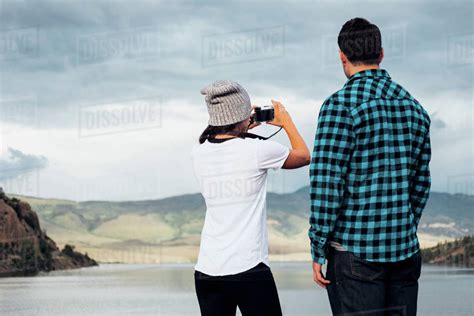 Couple Beside Dillon Reservoir Taking Photograph Rear View Silverthorne Colorado USA