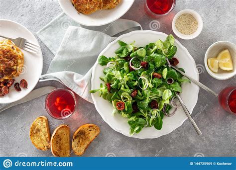 Dinner Table With Bowl Green Salad Cutlets Rustic Style Stock Image