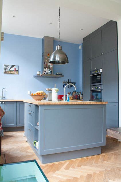 There is a good chance you have a line of sight into the kitchen. full wall cabinets on the left, prep island with storage below eclectic kitchen by Louise de ...