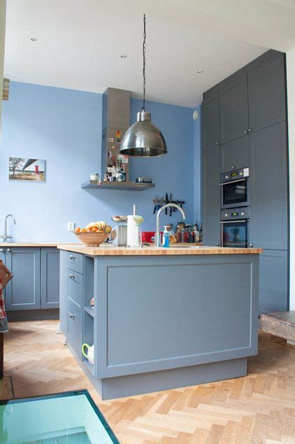 The ideal upper cabinet height is 54 inches above the floor. full wall cabinets on the left, prep island with storage below eclectic kitchen by Louise de ...