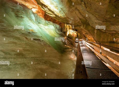 Walkway Passing A Massive Wall Of Ice Inside The Dachstein