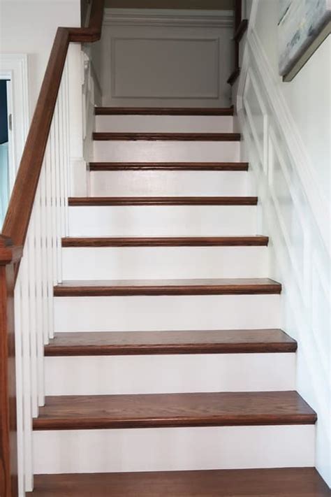 The contrasting white brings out the natural beauty of the wood much better than solid hardwood risers can. How-To Prep and Paint Stained Stairs White | Stairs painted white, Painted stair risers, Stained ...