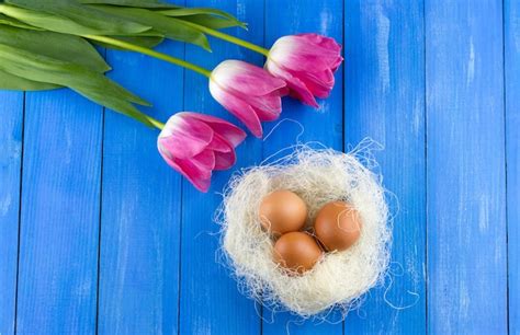 Premium Photo Tulips And Easter Eggs In The Nest