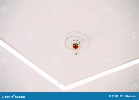 Automatic Ceiling Fire Sprinkler System On White Ceiling Stock Image