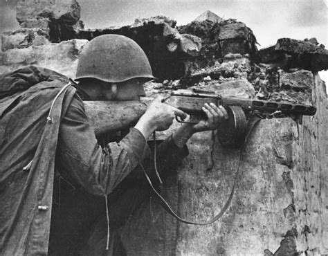 The Soviet Machine Gunner Is Fighting In The Village On The Outskirts