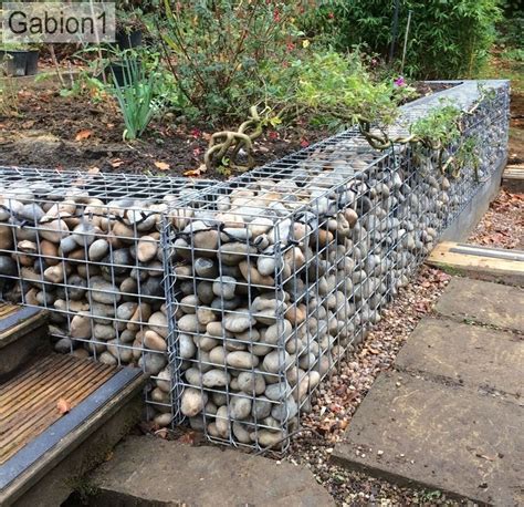 Small Garden Gabion Retaining Wall Filled With Rounded Cobbles