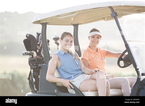 Women Driving Golf Cart On Course Stock Photo Alamy