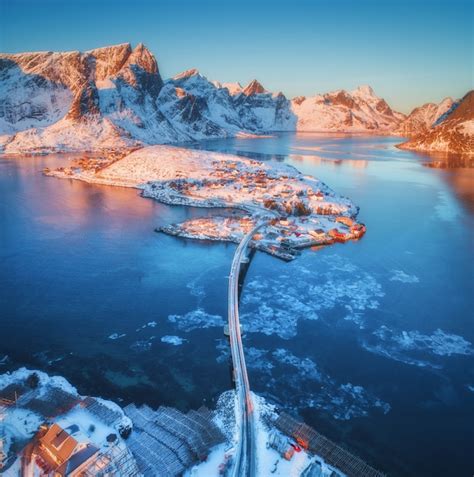 Premium Photo Aerial View Of Bridge Over The Sea And Snowy Mountains