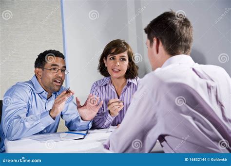 Three Mid Adult People Sitting At Table Meeting Stock Photo Image Of