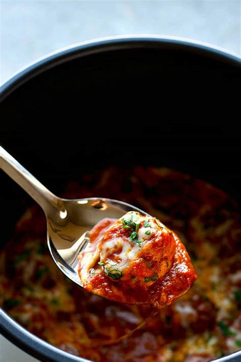 This instant pot low carb instant pot chicken parmesan with marinara sauce is perfect for indulging while yet eating healthy! Instant Pot Chicken Parmesan Meatballs