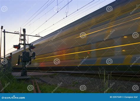 A Train Passing At High Speed Stock Image Image Of Undergrowth Blue