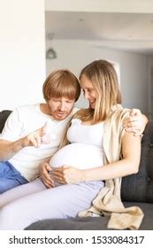 Joyful Pregnant Couple Having Fun Home Stock Photo