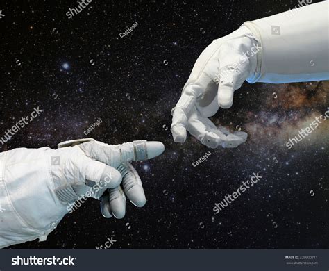 Stock Photo Astronaut Hand And Robotic Hand On Outer Space Background