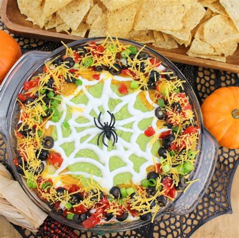 A Spider Web Cake With Cheese Black Olives And Peppers