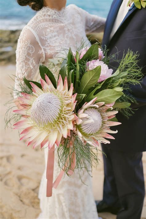 Pink protea, ranunculus, rose, medinilla, white hydrangea, seede. 30 Amazing Protea Wedding Bouquets | Martha Stewart Weddings