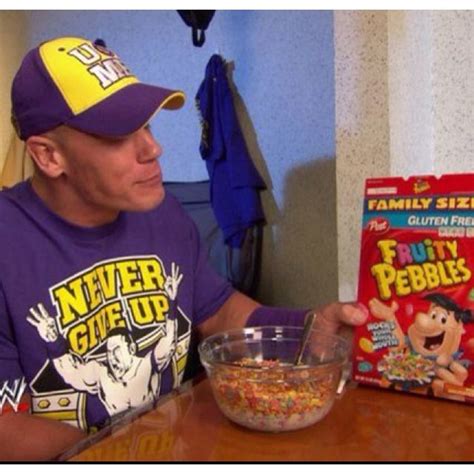 A Man Sitting At A Table With Cereal In Front Of Him And His Cereal Box
