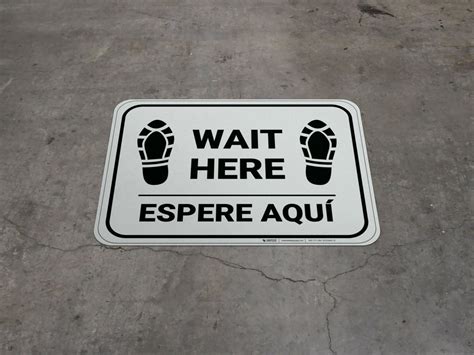 Wait Here Espere Aqui Shoe Prints Bilingual Spanish Rectangle Floor Sign