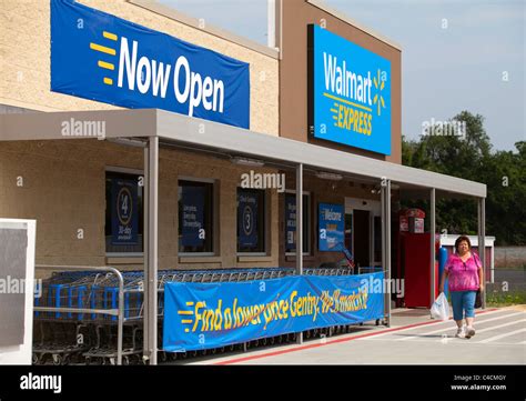 A Woman Exits A Walmart Express Store In Gentry Arkansas Usa Stock