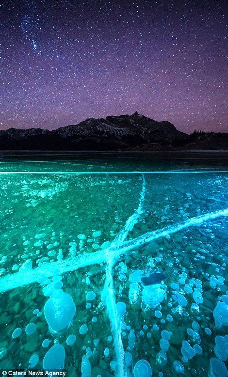 Stunning Images Reveal Frozen Bubbles Lit Up By Northern Lights