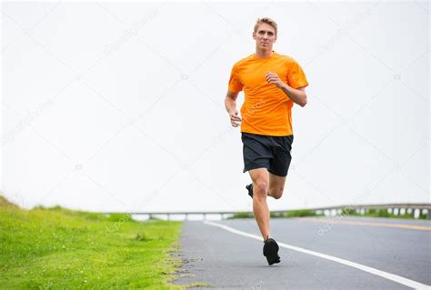 Athletic Man Running Jogging Outside — Stock Photo © Epicstockmedia