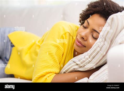 African Young Woman Sleeping On Sofa At Home Stock Photo Alamy