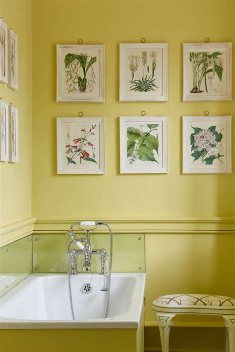 Creamy yellow wall color helps the vanity relate to a stark white bathtub. Bathroom ideas | Yellow bathroom decor, Yellow bathrooms, Yellow bathroom walls