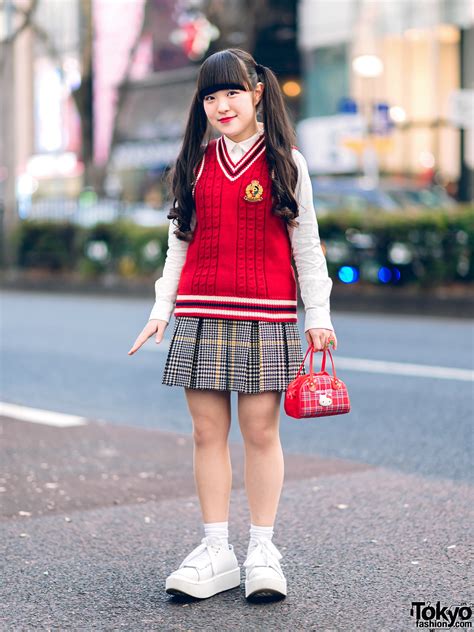 harajuku girl in kawaii pink house street style w plaid skirt knit vest hello kitty bag