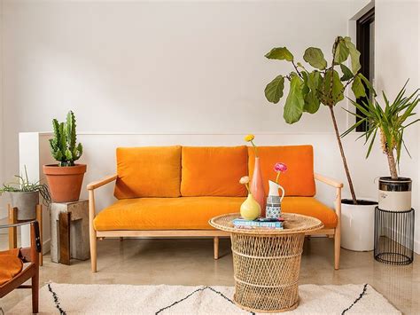 Living Room With Orange Couch Were Loving In The Living Room The