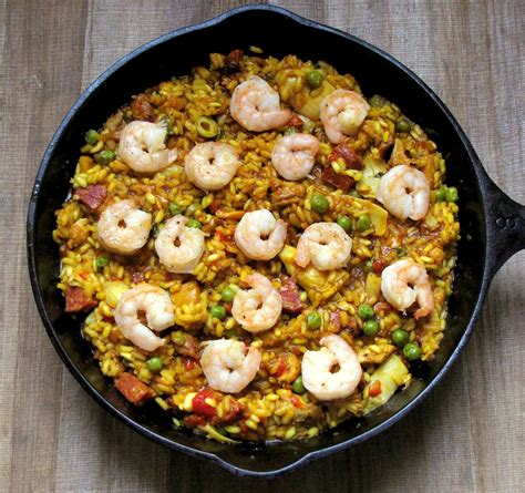 A popular rice dish, paella originated in the valencia region of spain, and can made with a multitude of different ingredients, including chicken, pork, shellfish, fish, eel, sausage reduce the temperature to 350°f, close the grill lid, and cook for 10 minutes. Mixed Paella with Chicken, Chorizo and Shrimp recipe on ...