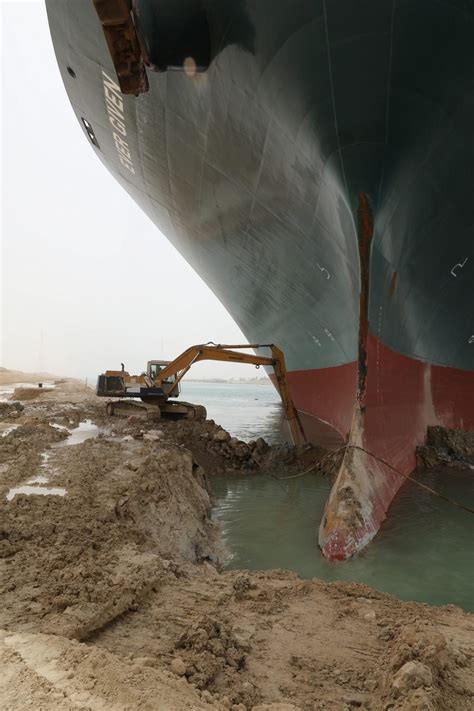 The ever given is stuck in the suez canal. Hopes and memes rest on 'tiny' excavator digging out Suez ...