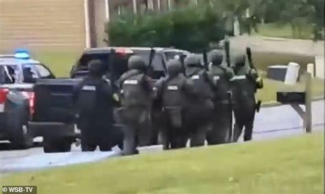 Swat Team Raids Suburban Atlanta Home To Arrest Four People Who Were Running An Illegal Strip