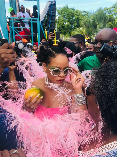 rihanna wears huge pink feather dress to barbados crop over festival