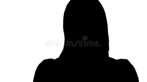 Silhouette Young Caucasian Blond Woman Looking At Camera Preening