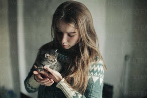 Caucasian Woman Holding Kitten Stock Photo