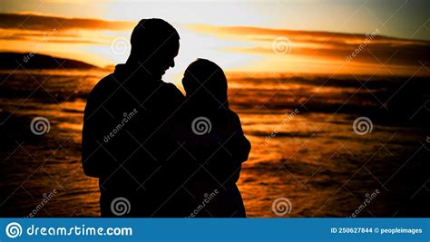 Silhouette Affectionate Young Couple Sharing An Intimate Moment On The