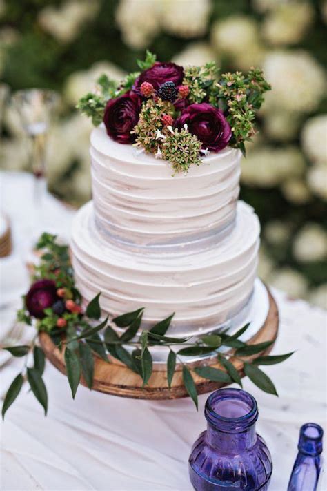 Detail of a romantic blue wedding cake decorated with hand made frosted sugar roses, snow christals and sugar christals, on a blue. Gorgeous Fall Wedding Cakes We're Drooling Over - Southern ...