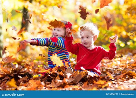 Kids Playing In Autumn Park Stock Image Image Of Beautiful October