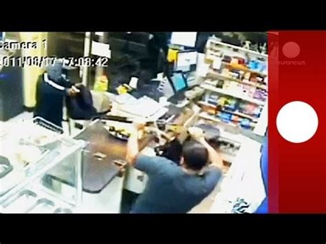 CCTV Machete Wielding Clerk Chases Off Armed Robber In New York YouTube