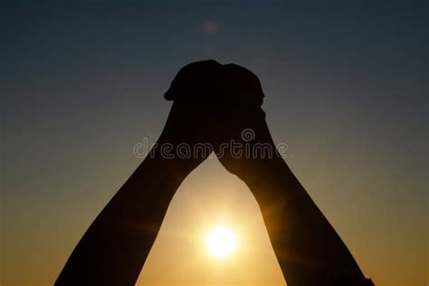 Human`s Hand Praying Meditating In Harmony And Peace At Sunset