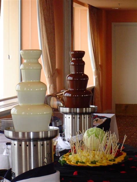 Chocolate Fountains With Assortment Of Fruit And Sweets Chocolate