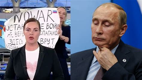 russian tv editor interrupts live broadcast with sign reading no war photo video