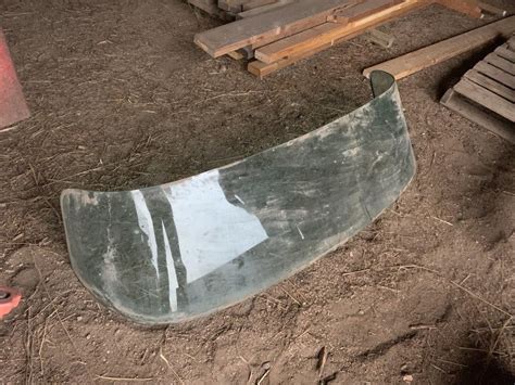 Pictured is a custom acrylic replacement boat windshield. Curved Glass Windshield--possibly for a boat | Dacotah ...