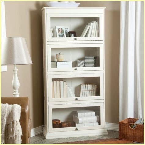 A pair of wooden bookshelves with glass lower doors #bibliotheque #bookshelf #bookshelves #cabinet #corner_bookshelf #doors #library. White Bookcase with Glass Door for Elgant Interior with ...