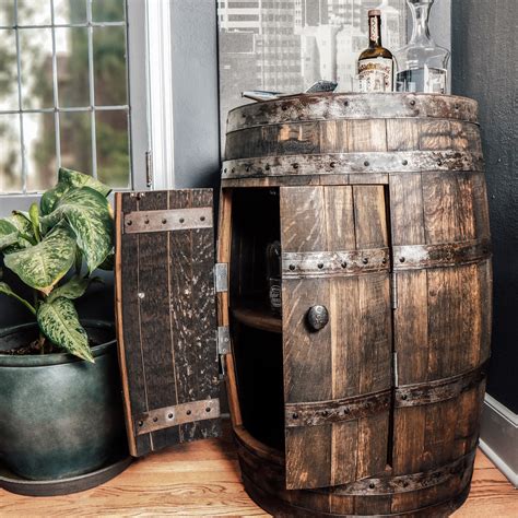 This whiskey barrel mini bar will add a cool, rustic look to your den, man cave, or living room, and is a unique conversation piece. Recycled Whiskey Barrel Cabinet | Whole Barrel Cabinet ...