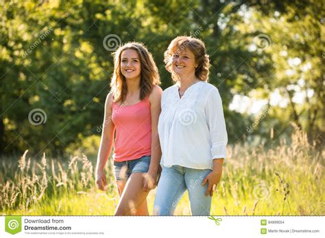 Mother And Teenage Daughter Walk In Nature Stock Photo Image Of