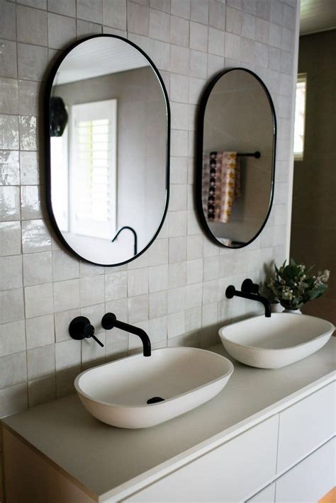 Oval Mirrors Help Create A Variation To The Structural Shapes Of